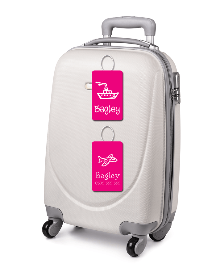 White suitcase with pink luggage tags